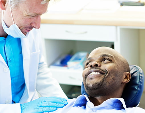 smiling man at dentist