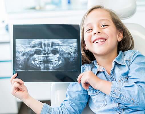 smiling girl with xrays